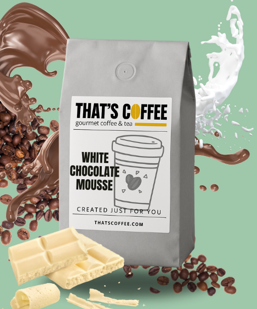 A bag of That’s Coffee White Chocolate Mousse blend is displayed with coffee beans, milk splash, chocolate swirl, and pieces of white chocolate on a green background.