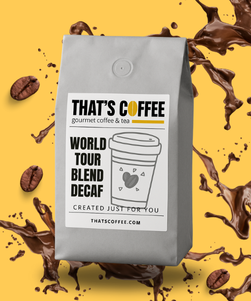 A gray bag of That's Coffee World Tour Blend Decaf sits on a yellow background, surrounded by decaf coffee beans and playful splashes.
