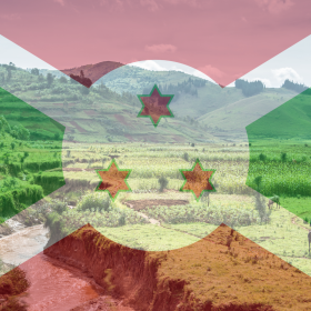 The Burundi flag overlaying a rural landscape with fields, hills, a stream, grazing animals, and rows of Jamaican Coffee Beans thriving in the fertile soil.