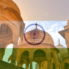 Yellow sandstone domed structures with the Indian flag's colors and Ashoka Chakra overlayed across the image, evoking the rich heritage of India Coffee Beans.