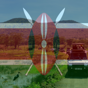 A safari vehicle drives near a lake with birds and greenery, overlaid with the Kenyan flag displaying a shield and spears—echoing the rich landscapes where Kenya coffee beans are grown.